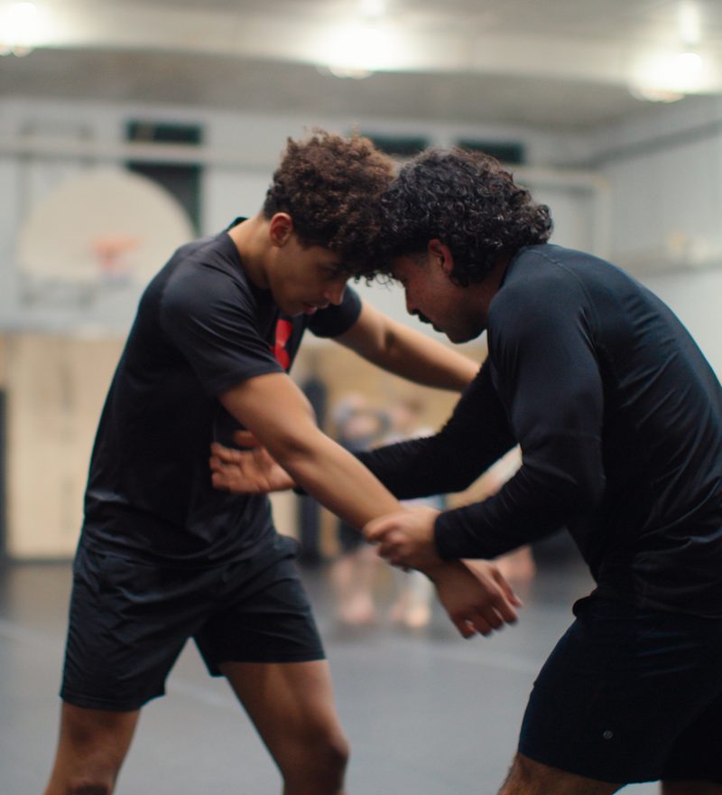 Teen students working a wrestling clinch