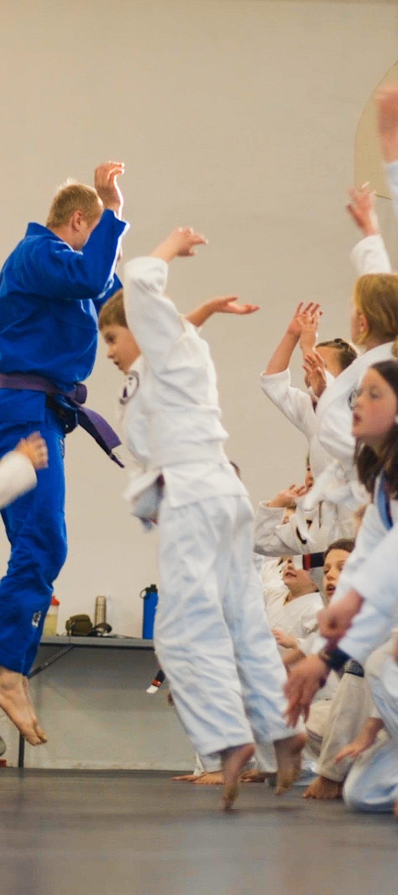 Kids BJJ class celebrating during training